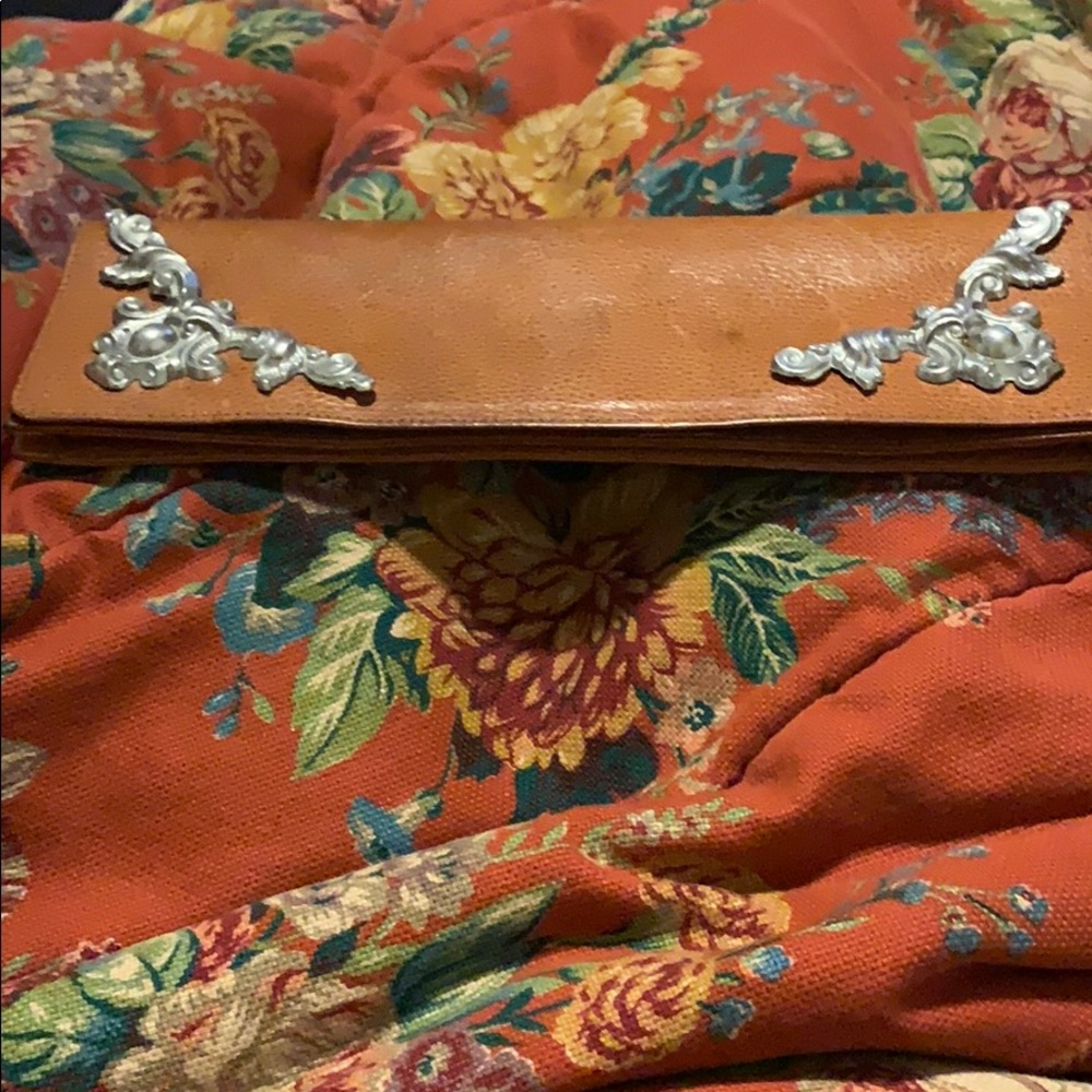 Leather embellished with ornate silver detail